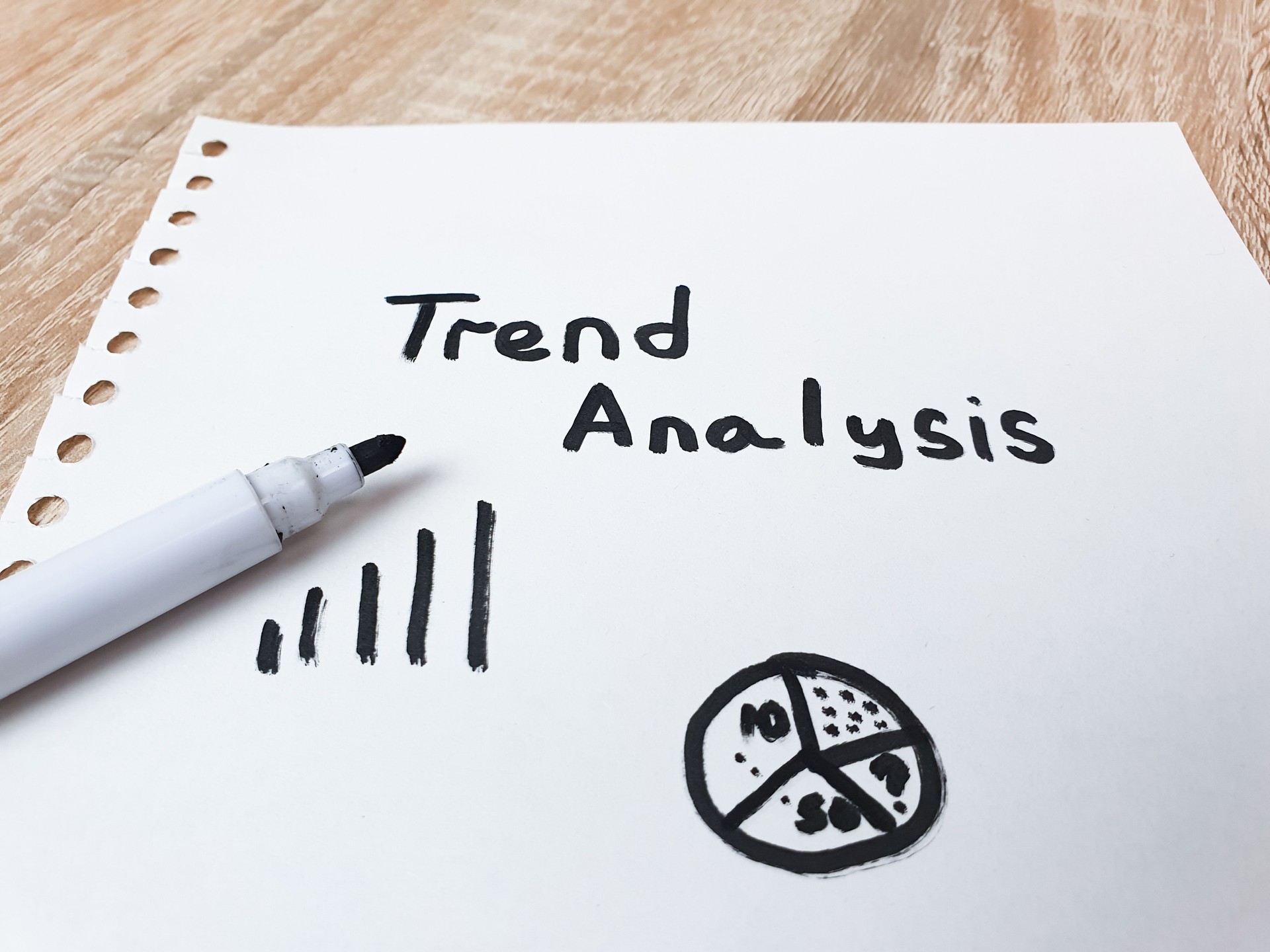 TREND ANALYSIS text, note on a notepad, studying market trends, business strategy, management, concept.